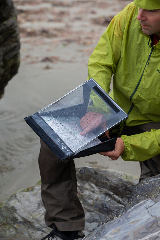 A waterproof clipboard used on a rainy beach