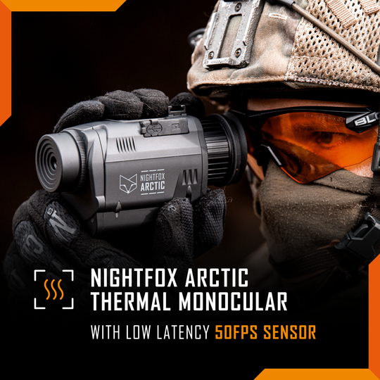 Person wearing a helmet and goggles with a Nightfox Arctic thermal monocular device.
